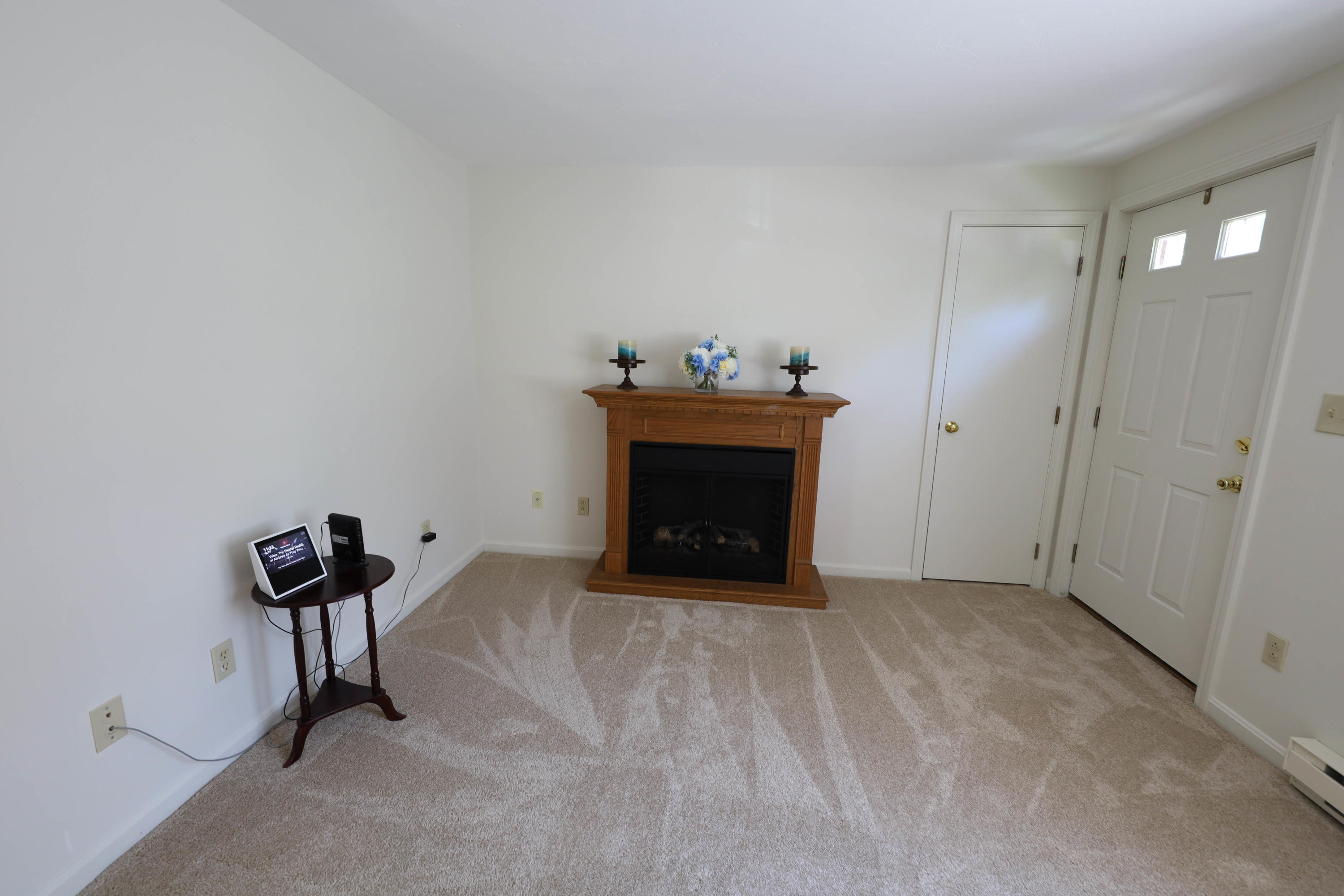 91 Quashnet Road Mashpee, MA 02649 - Photo 5 of 16 a room with furniture and a fireplace