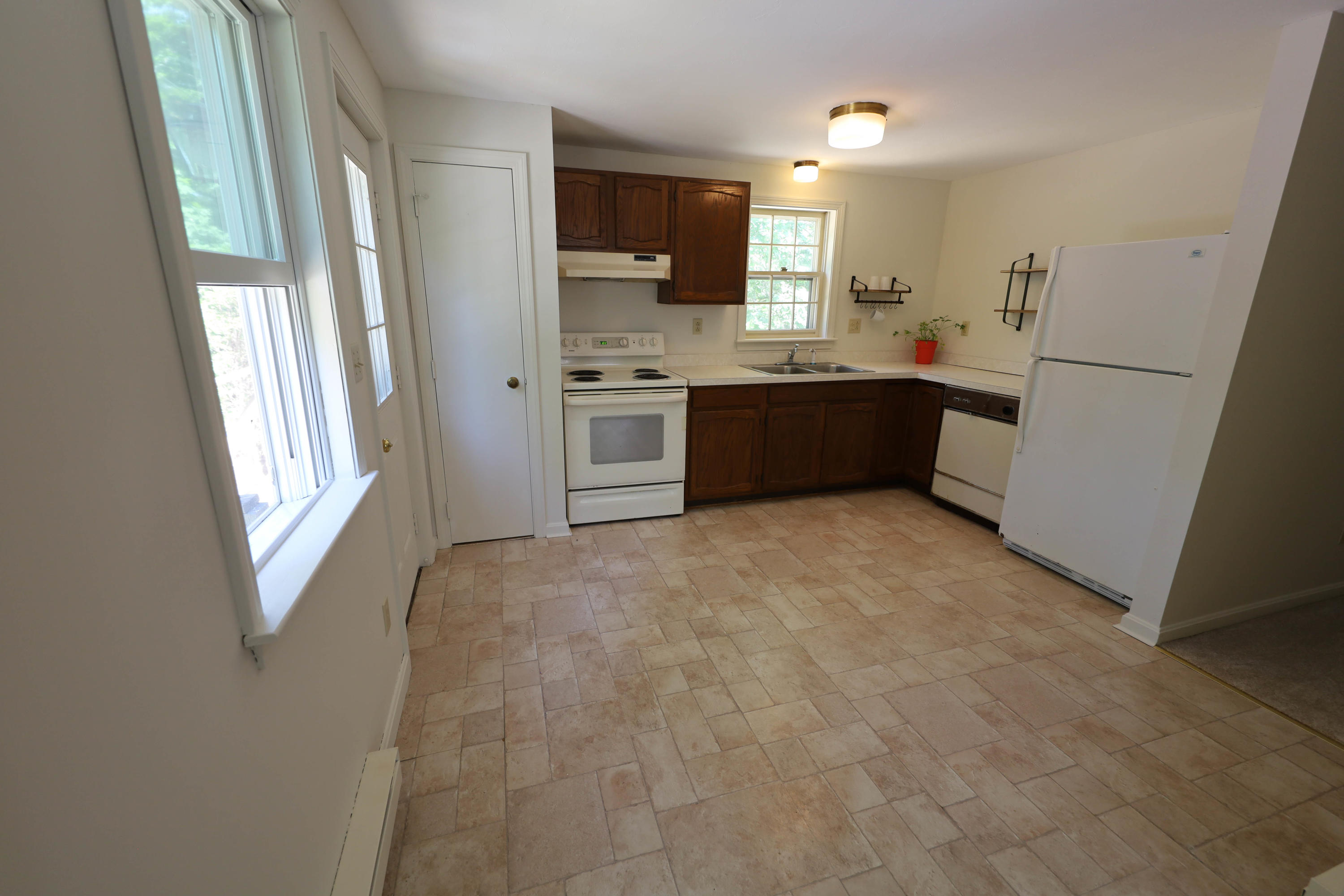 91 Quashnet Road Mashpee, MA 02649 - Photo 9 of 16 a kitchen with a refrigerator sink and a microwave