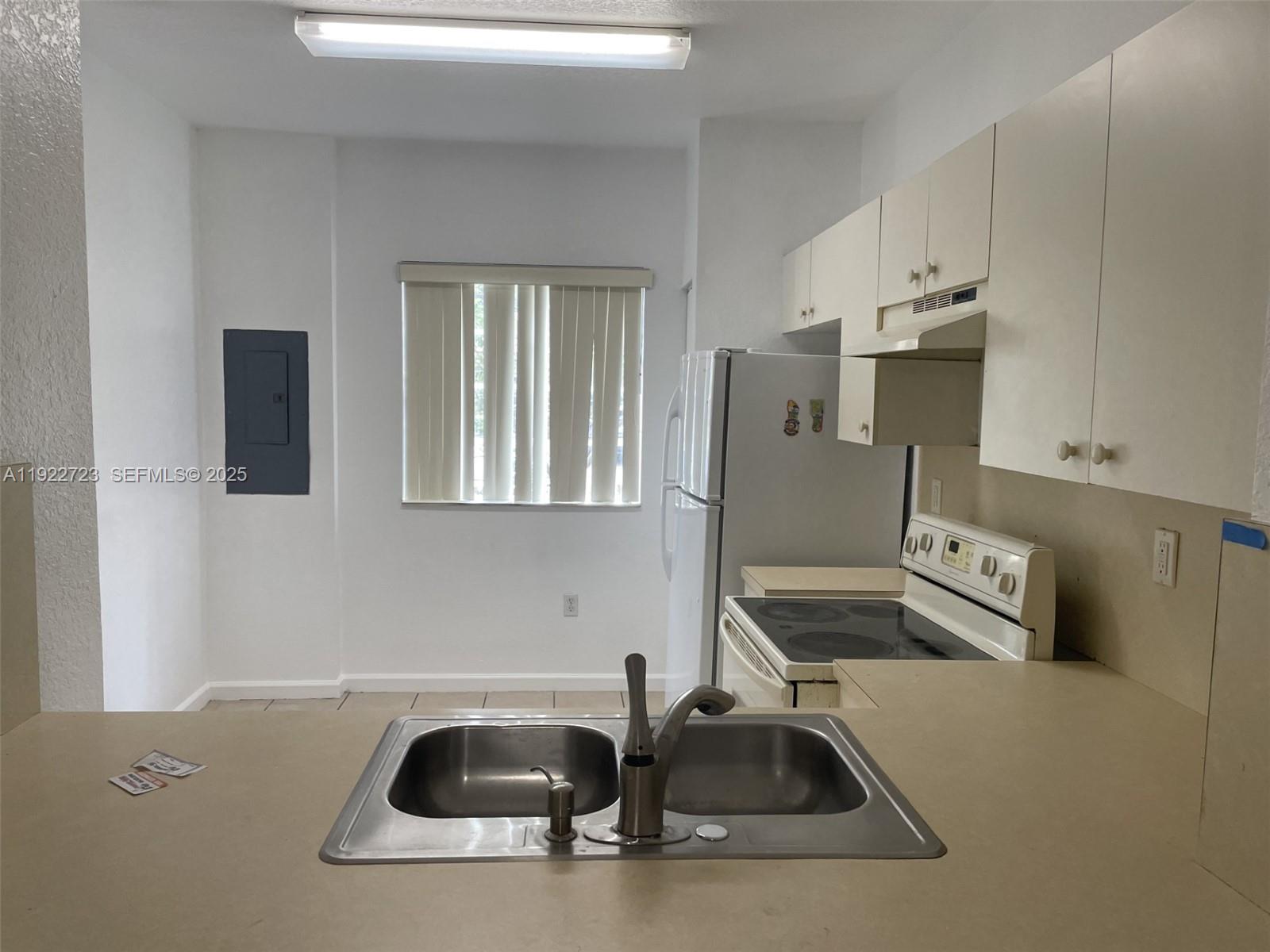 8831 South Isles Circle, Unit 8831 Tamarac, FL 33321 - Photo 11 of 22 a close view of sink and tap