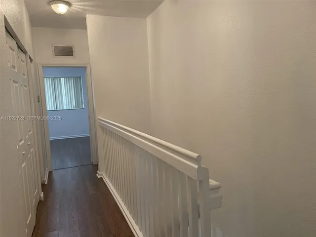 a view of hallway with stairs