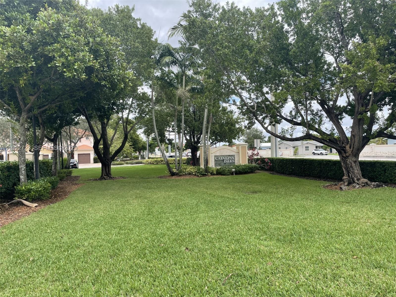 8831 South Isles Circle, Unit 8831 Tamarac, FL 33321 - Photo 2 of 22 a view of a trees in a park