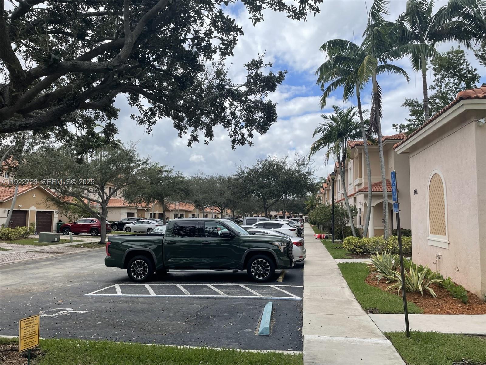 8831 South Isles Circle, Unit 8831 Tamarac, FL 33321 - Photo 4 of 22 a car parked on the side of a street