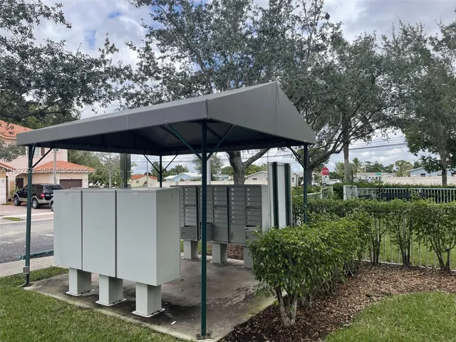 a view of a barn with a sink and a yard
