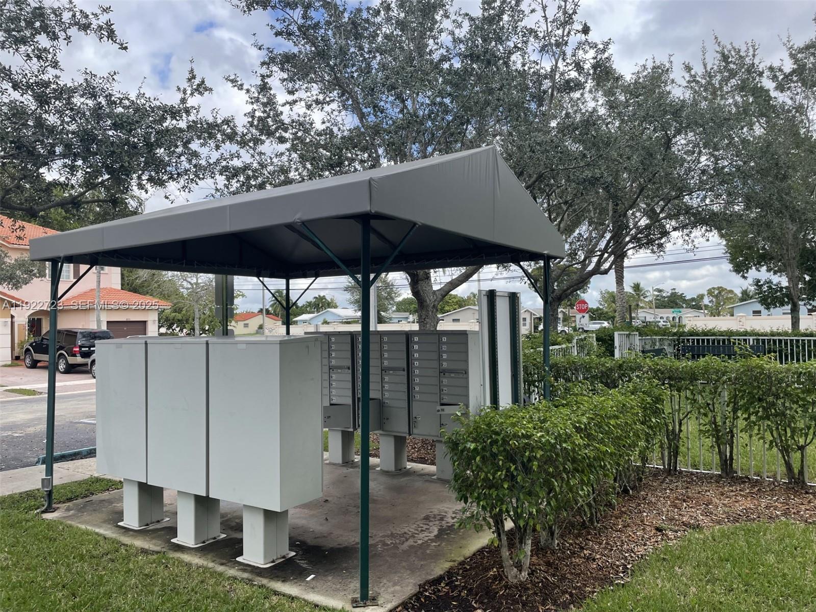 8831 South Isles Circle, Unit 8831 Tamarac, FL 33321 - Photo 8 of 22 a view of a barn with a sink and a yard