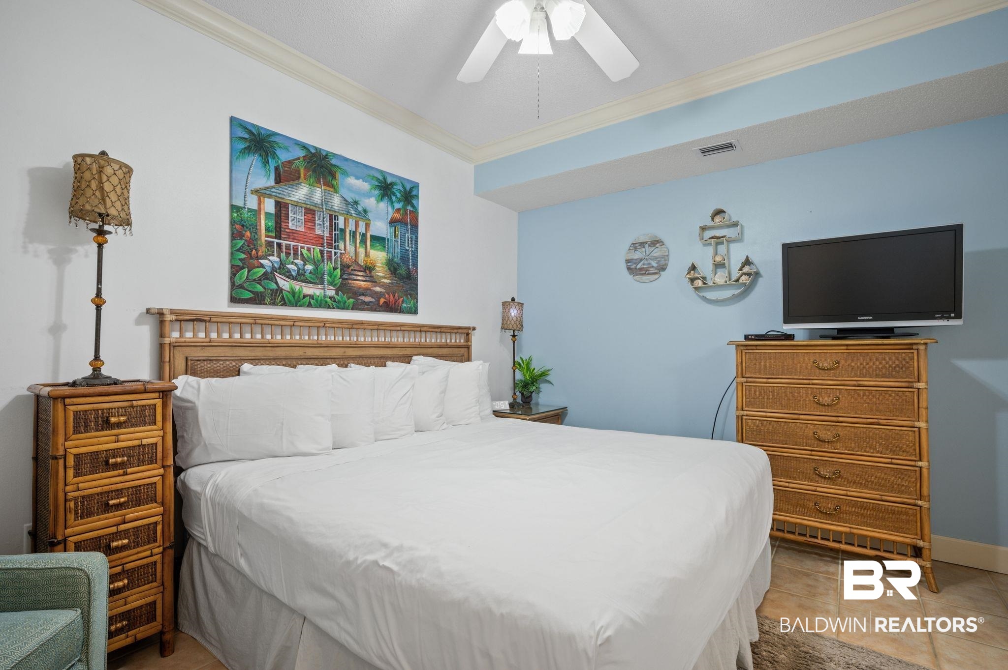 27580 Canal Road, Unit 1427 Orange Beach, AL 36561 - Photo 27 of 38 Bedroom with ornamental molding, a ceiling fan, and light tile patterned flooring