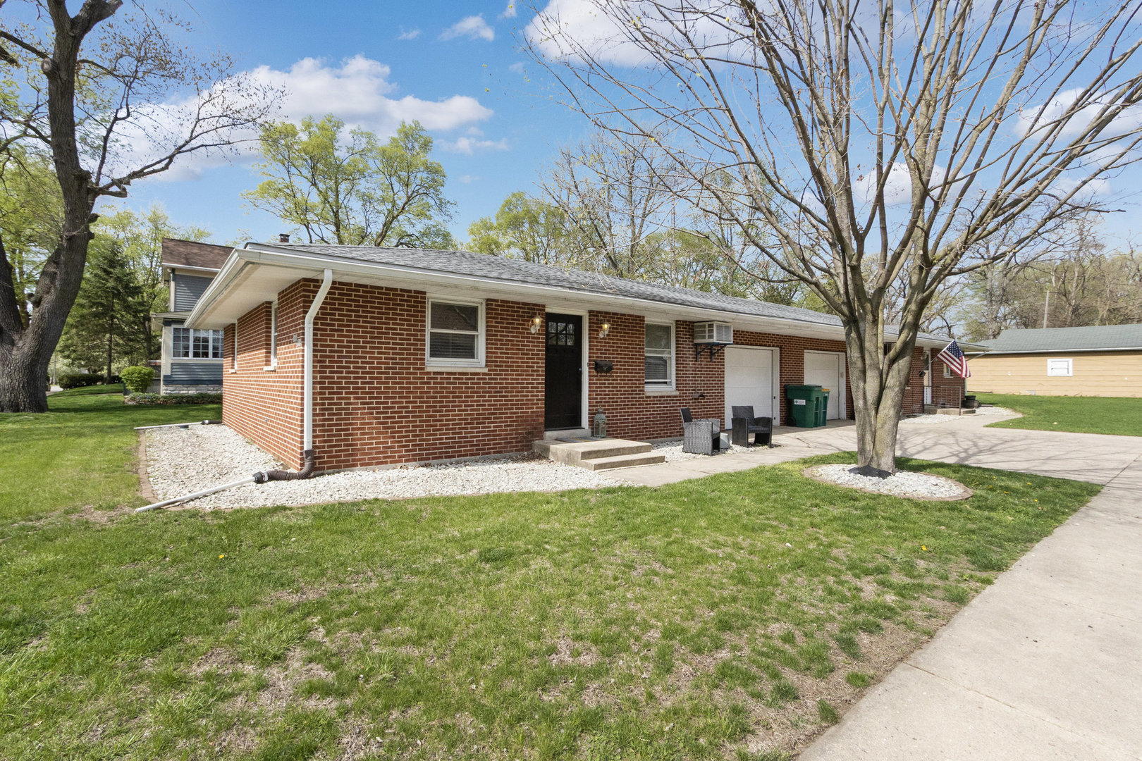 309 South Joliet Street, Unit 309 Wilmington, IL 60481 - Photo 1 of 12 a view of a house with a yard and sitting area