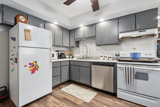 a white refrigerator freezer sitting inside of a kitchen