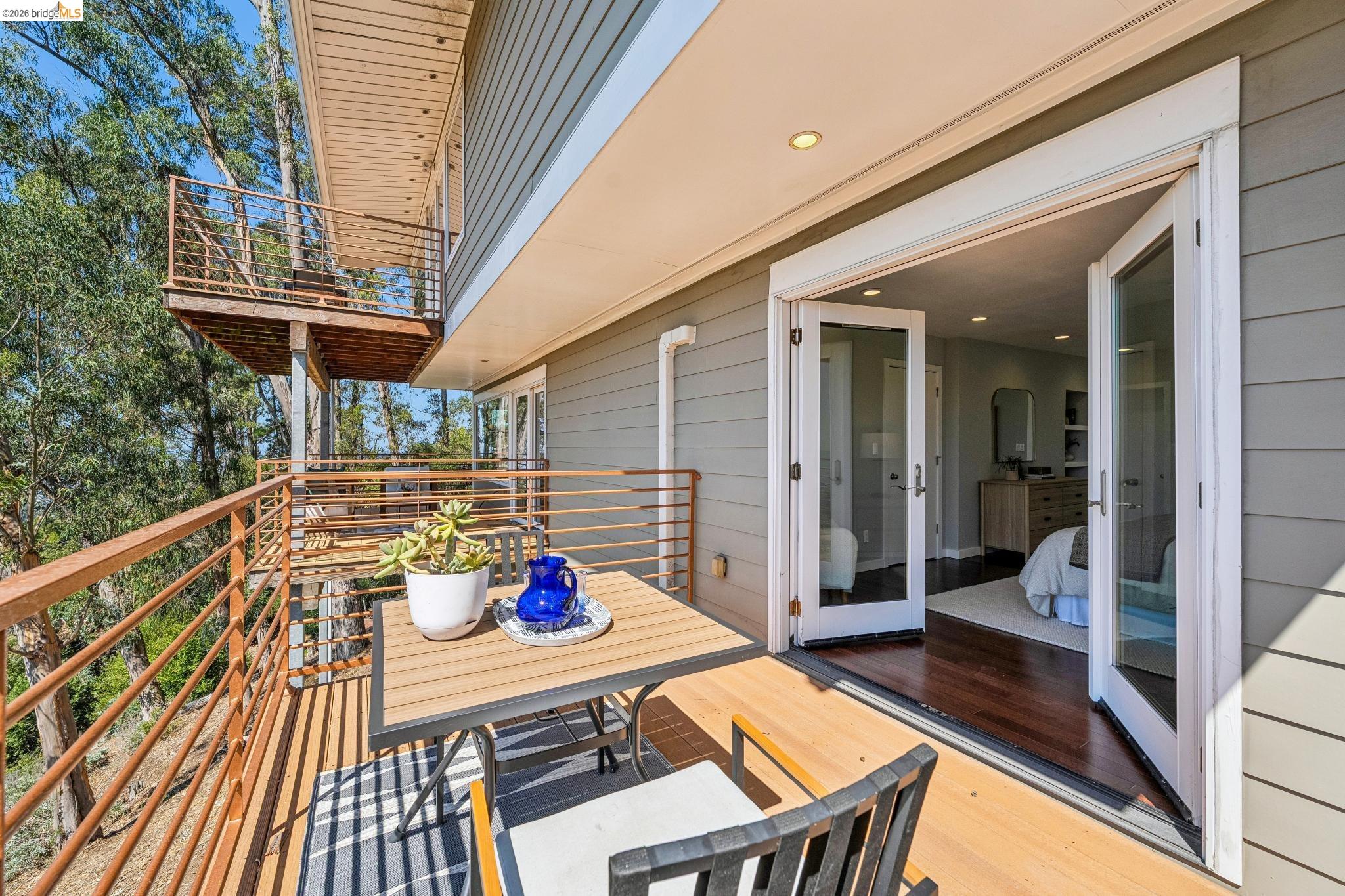1394 Queens Road Berkeley, CA 94708 - Photo 49 of 63 Expansive wood-finish deck with metal railings and a multi-level design