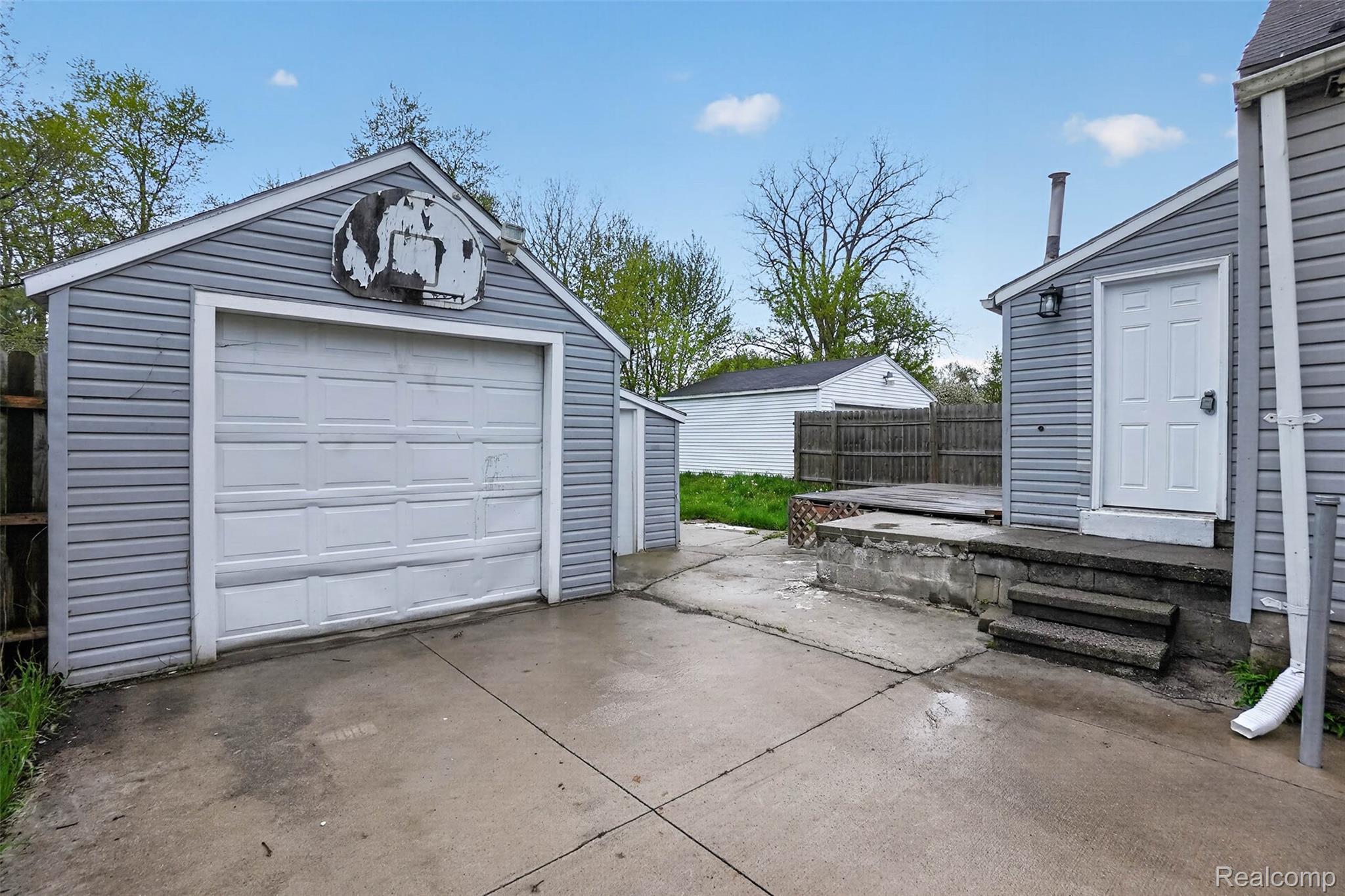 4910 Hughes Road Lansing, MI 48910 - Photo 26 of 27 Detached garage featuring driveway