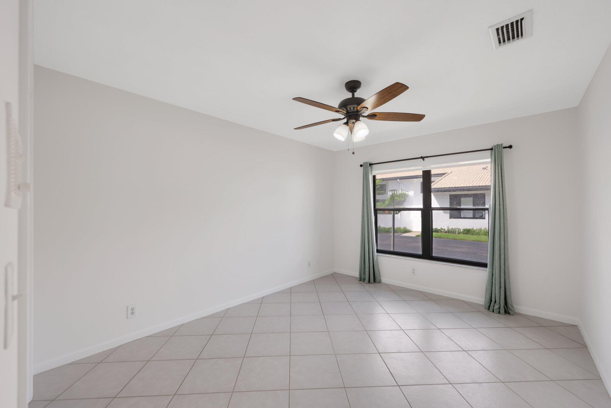361 West Camino Real, Unit 9 Boca Raton, FL 33432 - Photo 17 of 37 a view of an empty room with a window