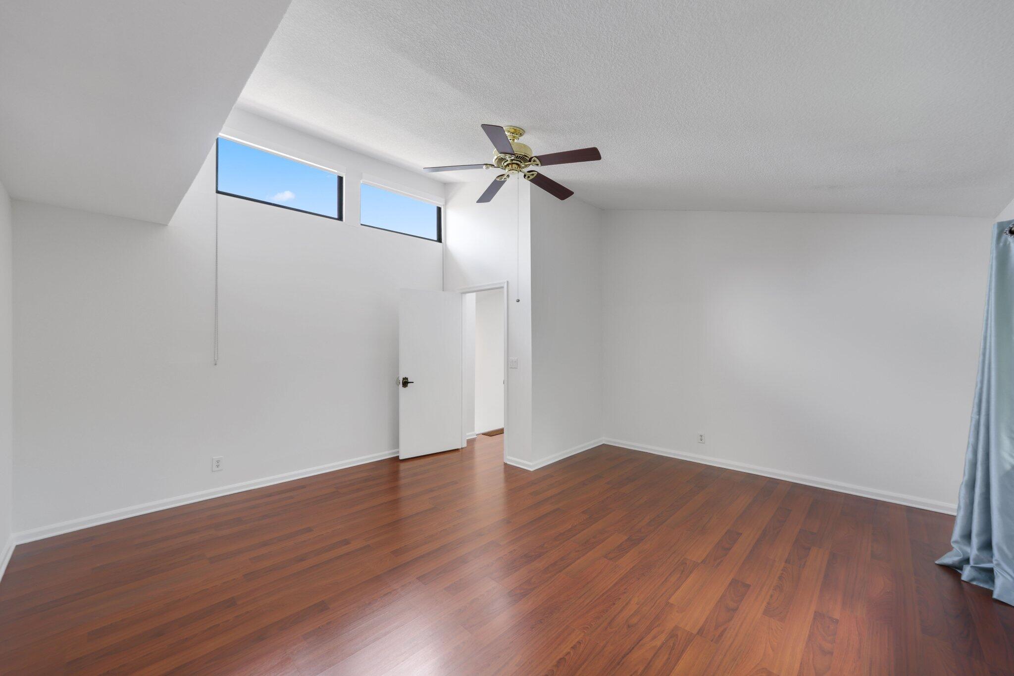 361 West Camino Real, Unit 9 Boca Raton, FL 33432 - Photo 21 of 37 wooden floor in an empty room