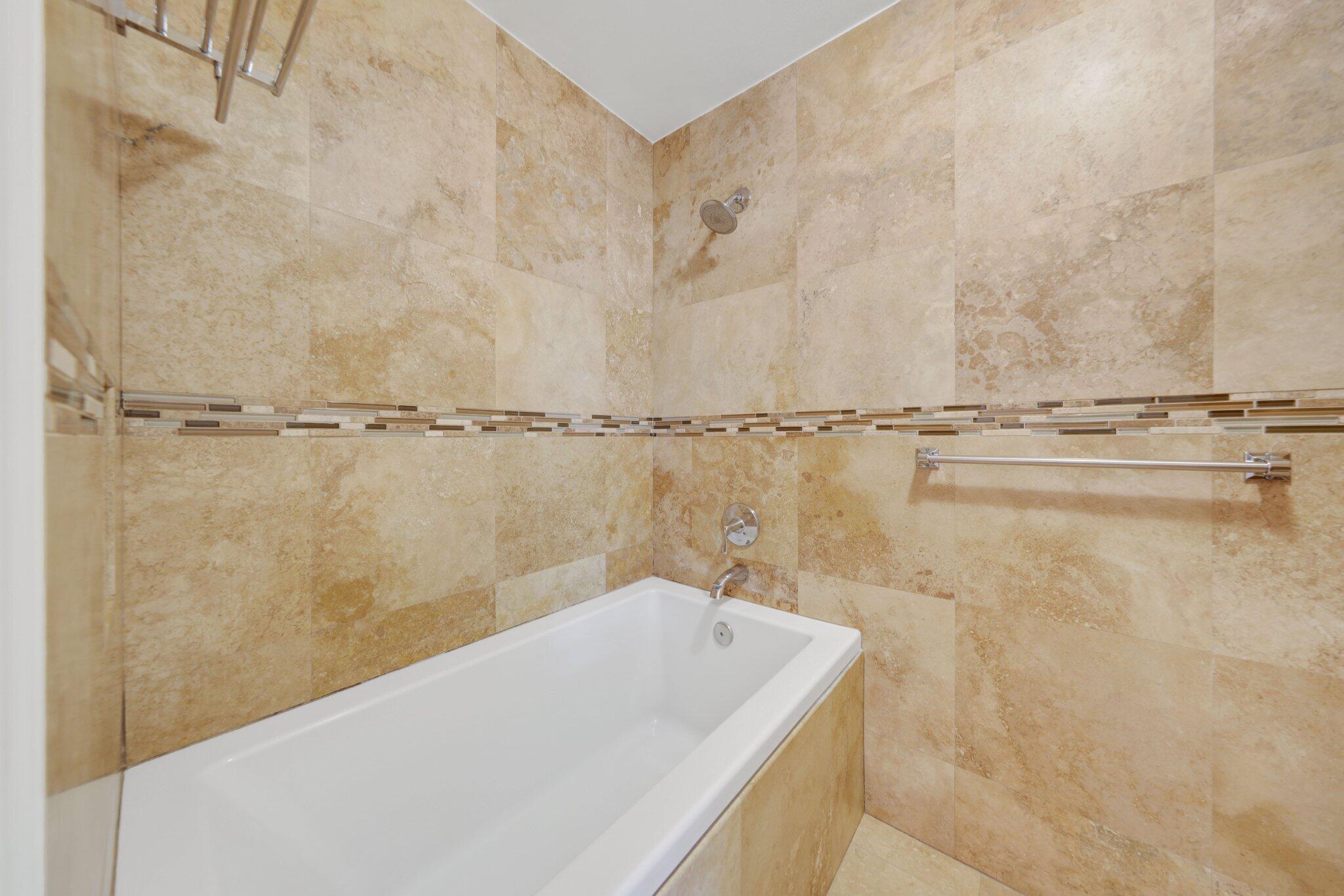 361 West Camino Real, Unit 9 Boca Raton, FL 33432 - Photo 23 of 37 a bathroom with a bathtub and shower