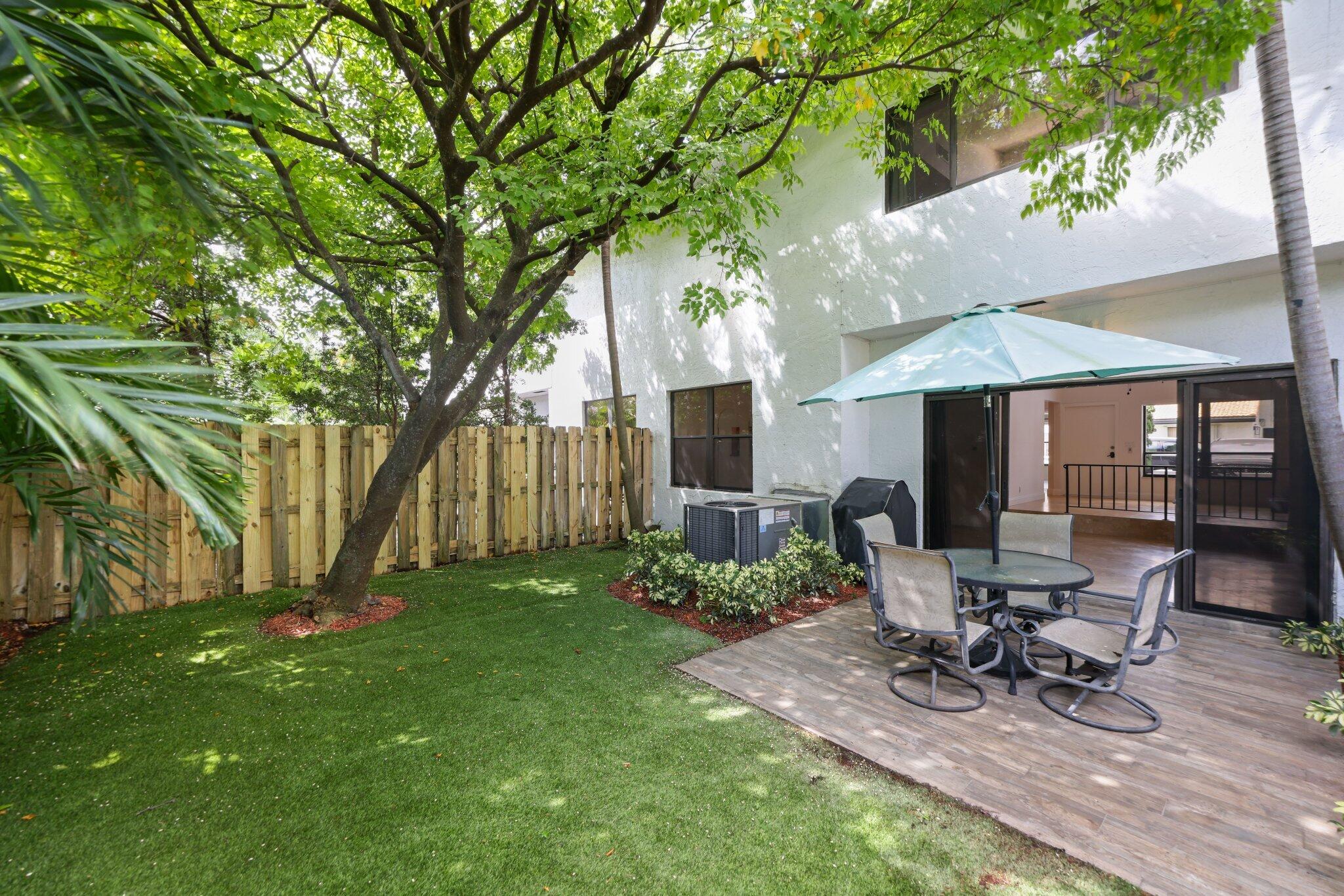 361 West Camino Real, Unit 9 Boca Raton, FL 33432 - Photo 28 of 37 a view of a house with backyard and sitting area