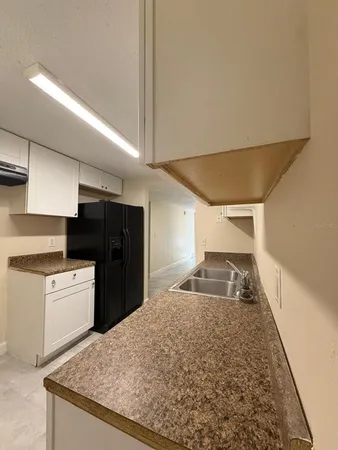 a large kitchen with cabinets