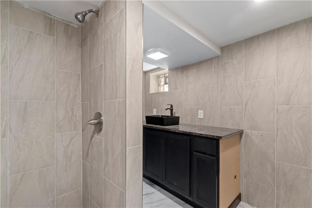813 Bower Hill Road Bridgeville, PA 15017 - Photo 11 of 13 a bathroom with a sink and mirror
