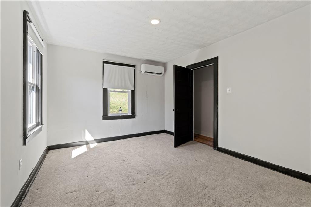 813 Bower Hill Road Bridgeville, PA 15017 - Photo 7 of 13 an empty room with windows and closet