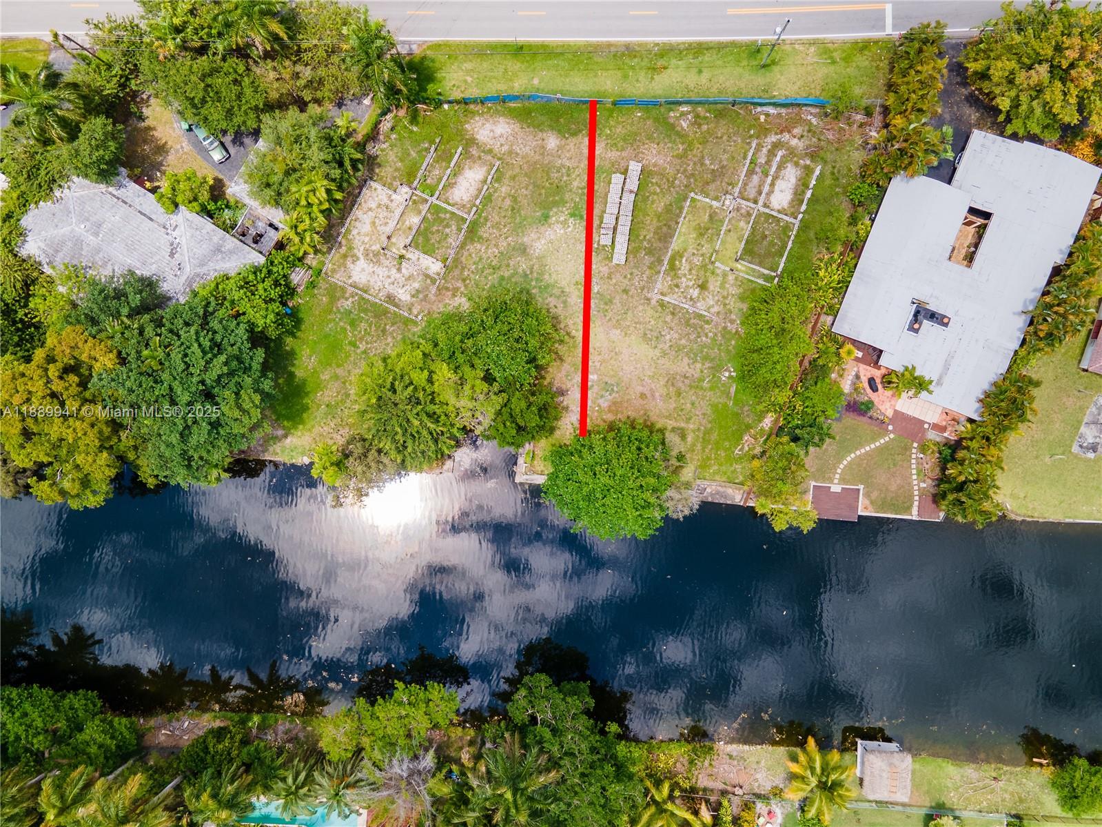 11595 West Biscayne Canal Road Miami, FL 33161 - Photo 12 of 14 a view of a yard with plants and large trees