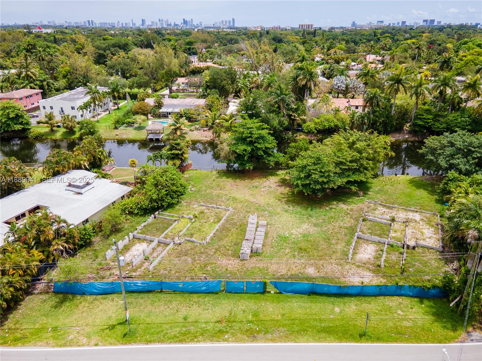 11595 West Biscayne Canal Road Miami, FL 33161 - Photo 2 of 14 an aerial view of residential houses with outdoor space