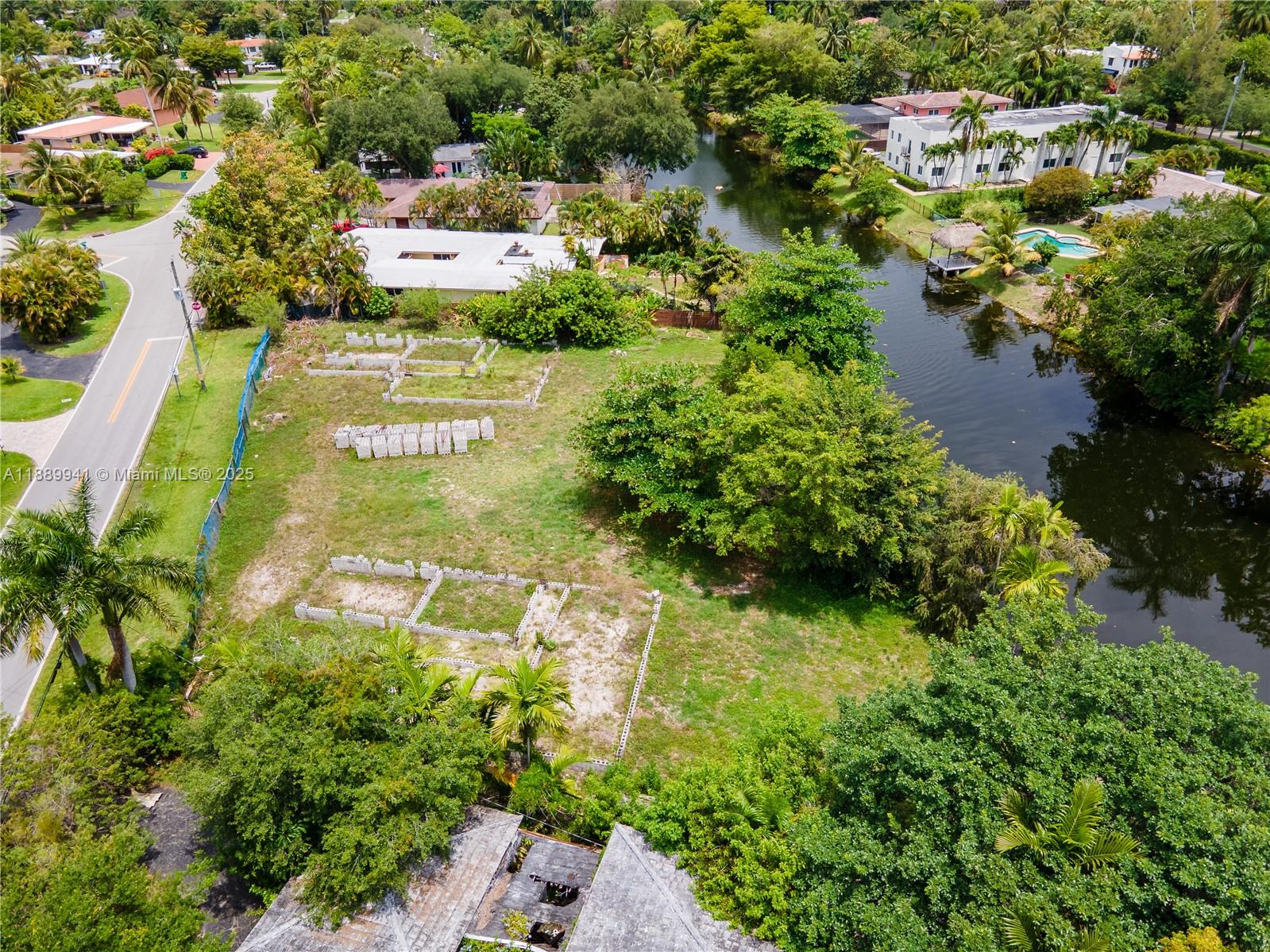 11595 West Biscayne Canal Road Miami, FL 33161 - Photo 6 of 14 an aerial view of residential house with outdoor space and trees all around