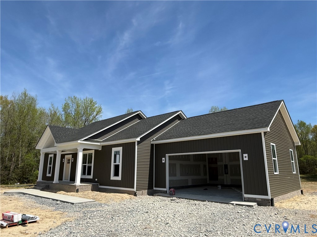 16751 Loving Union Road Disputanta, VA 23842 - Photo 5 of 12 a front view of a house with a yard