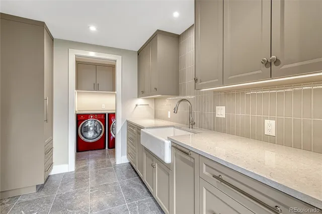 a view of a storage & utility room with washer and dryer