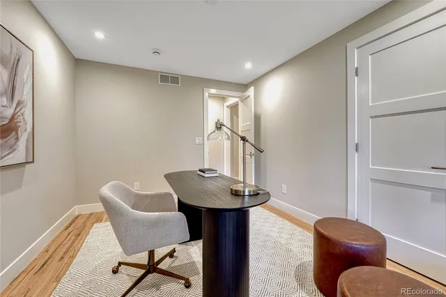 a workspace with furniture and wooden floor