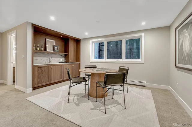 a view of a dining room with furniture and window