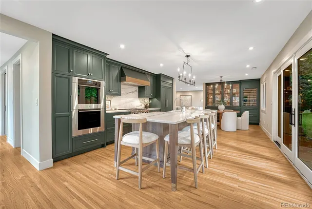 a dining room with furniture and wooden floor
