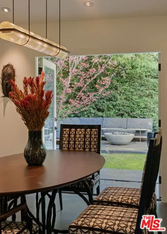 a kitchen with stainless steel appliances kitchen island granite countertop a stove and a sink