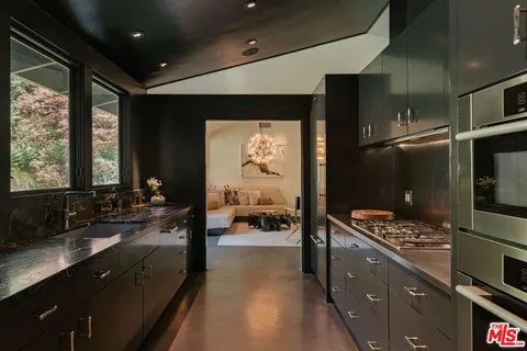 a bathroom with sink mirror and double