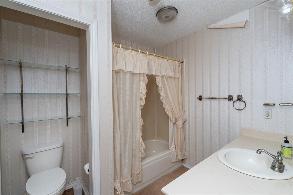 6000 Forrest Lane Canton, TX 75103 - Photo 13 of 37 a bathroom with a sink toilet and shower