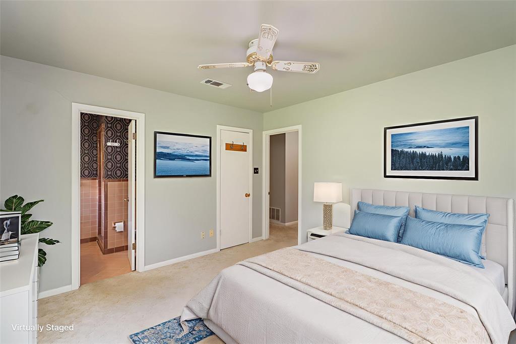 6000 Forrest Lane Canton, TX 75103 - Photo 14 of 37 a bedroom with a large bed and a chandelier