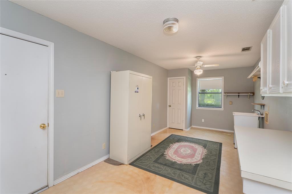 6000 Forrest Lane Canton, TX 75103 - Photo 22 of 37 a bathroom with a sink a vanity and a mirror