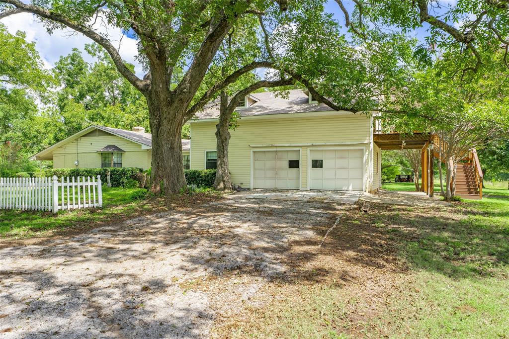 6000 Forrest Lane Canton, TX 75103 - Photo 33 of 37 a front view of a house with a garden