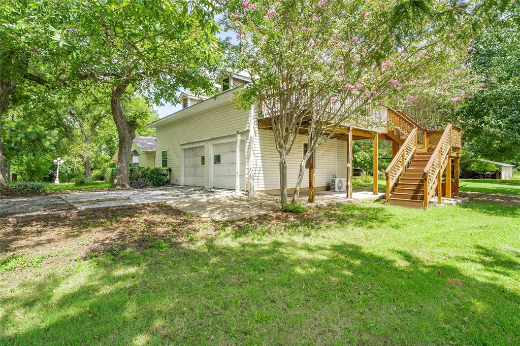 6000 Forrest Lane Canton, TX 75103 - Photo 34 of 37 a backyard of a house with table and chairs