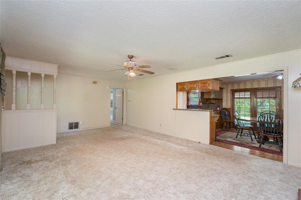 6000 Forrest Lane Canton, TX 75103 - Photo 4 of 37 a view of a livingroom with furniture and chandelier fan