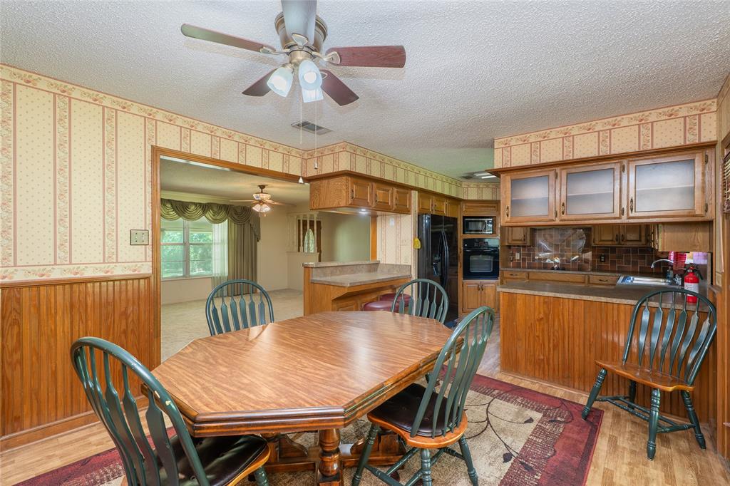 6000 Forrest Lane Canton, TX 75103 - Photo 5 of 37 a view of a dining room with furniture window and wooden floor