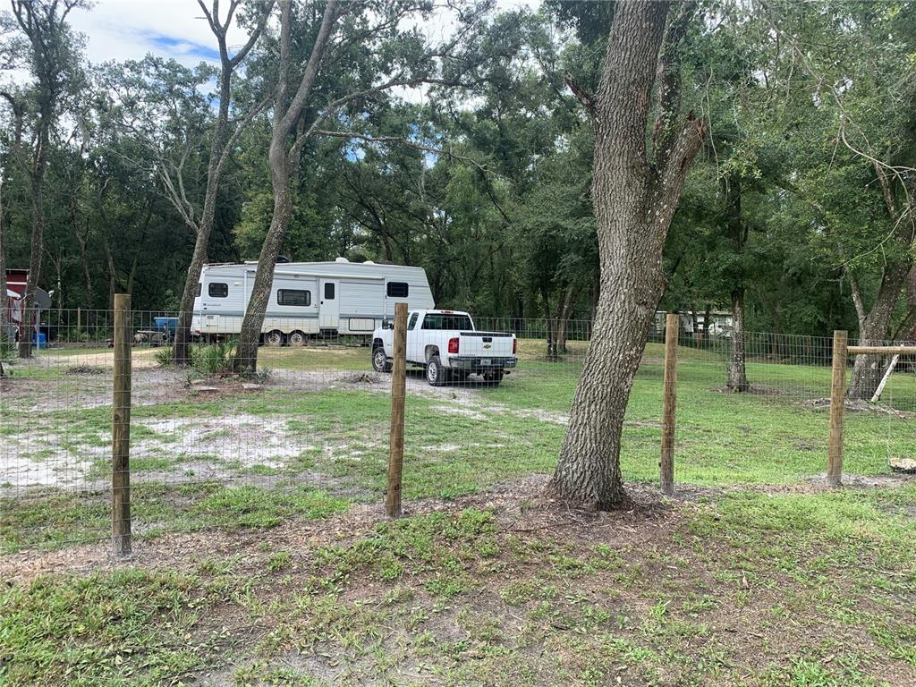 35314 Goethals Street Webster, FL 33597 - Photo 3 of 9 a childrens park with lots of swings and slides