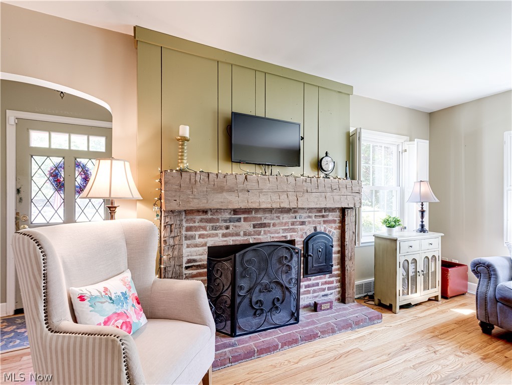 2000 Wiltshire Road Akron, OH 44313 - Photo 7 of 27 Living room featuring a fireplace and light hardwood / wood-style floors