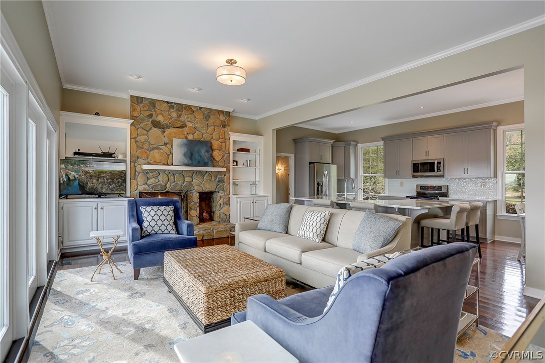 5149 Wakema Road West Point, VA 23181 - Photo 12 of 47 a living room with furniture and a fireplace