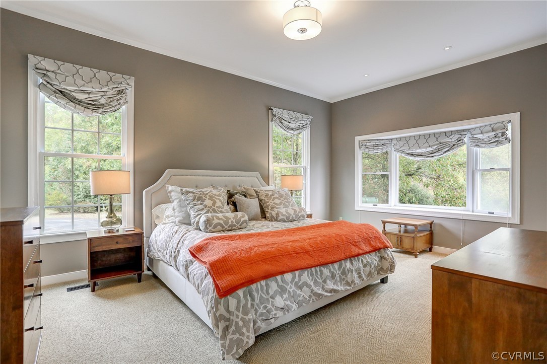 5149 Wakema Road West Point, VA 23181 - Photo 21 of 47 a bedroom with a bed and a large window