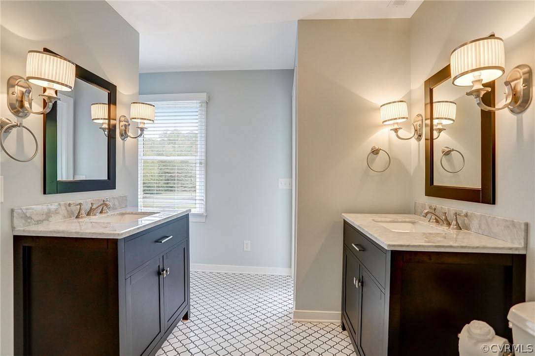 5149 Wakema Road West Point, VA 23181 - Photo 28 of 47 a bathroom with a double vanity sink mirror and