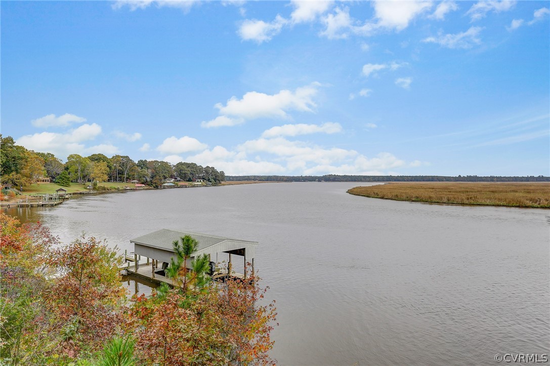 5149 Wakema Road West Point, VA 23181 - Photo 41 of 47 a view of a lake with houses in the back