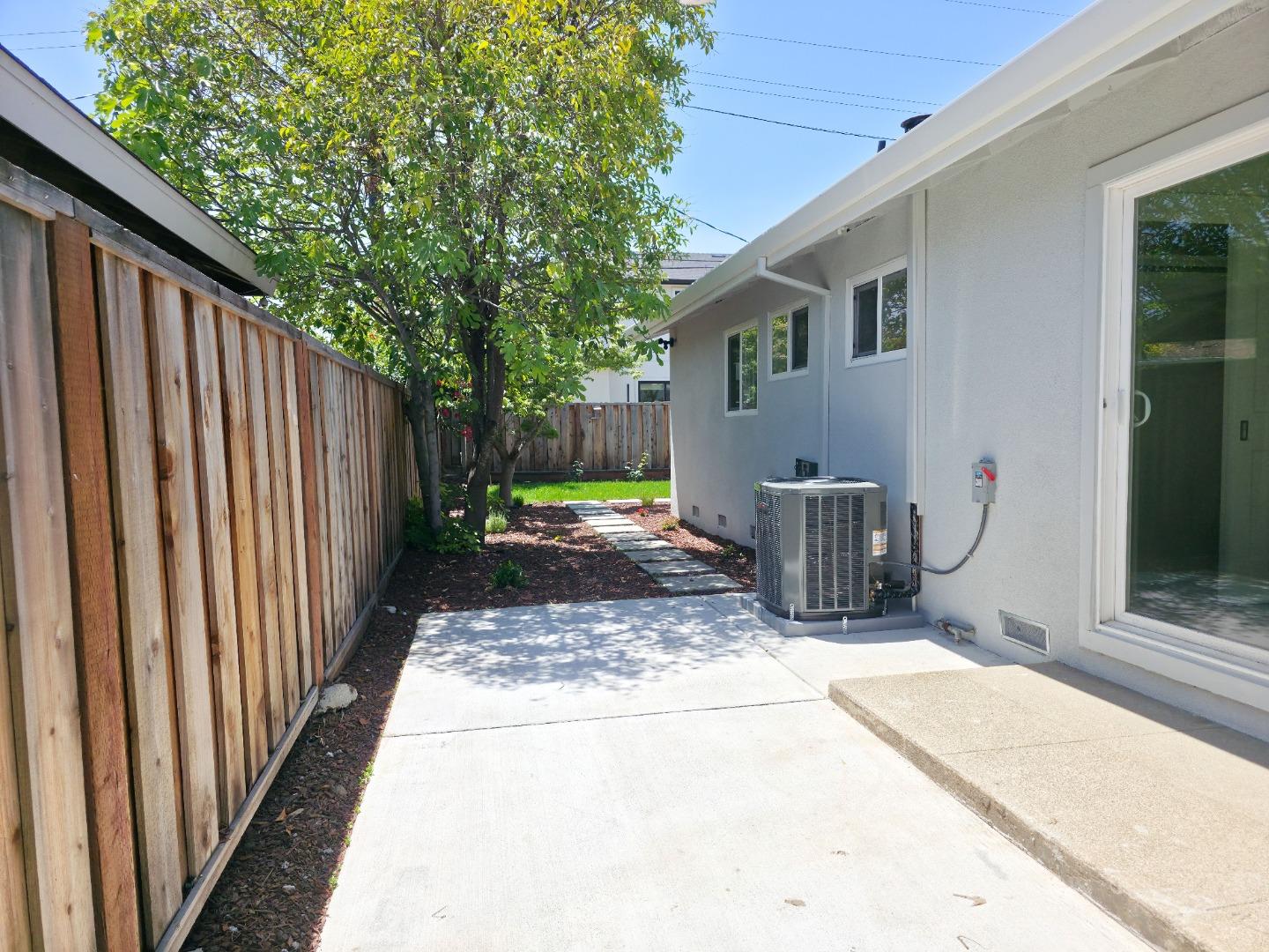 6746 Bollinger Road San Jose, CA 95129 - Photo 26 of 30 a view of backyard with small cabin and wooden fence