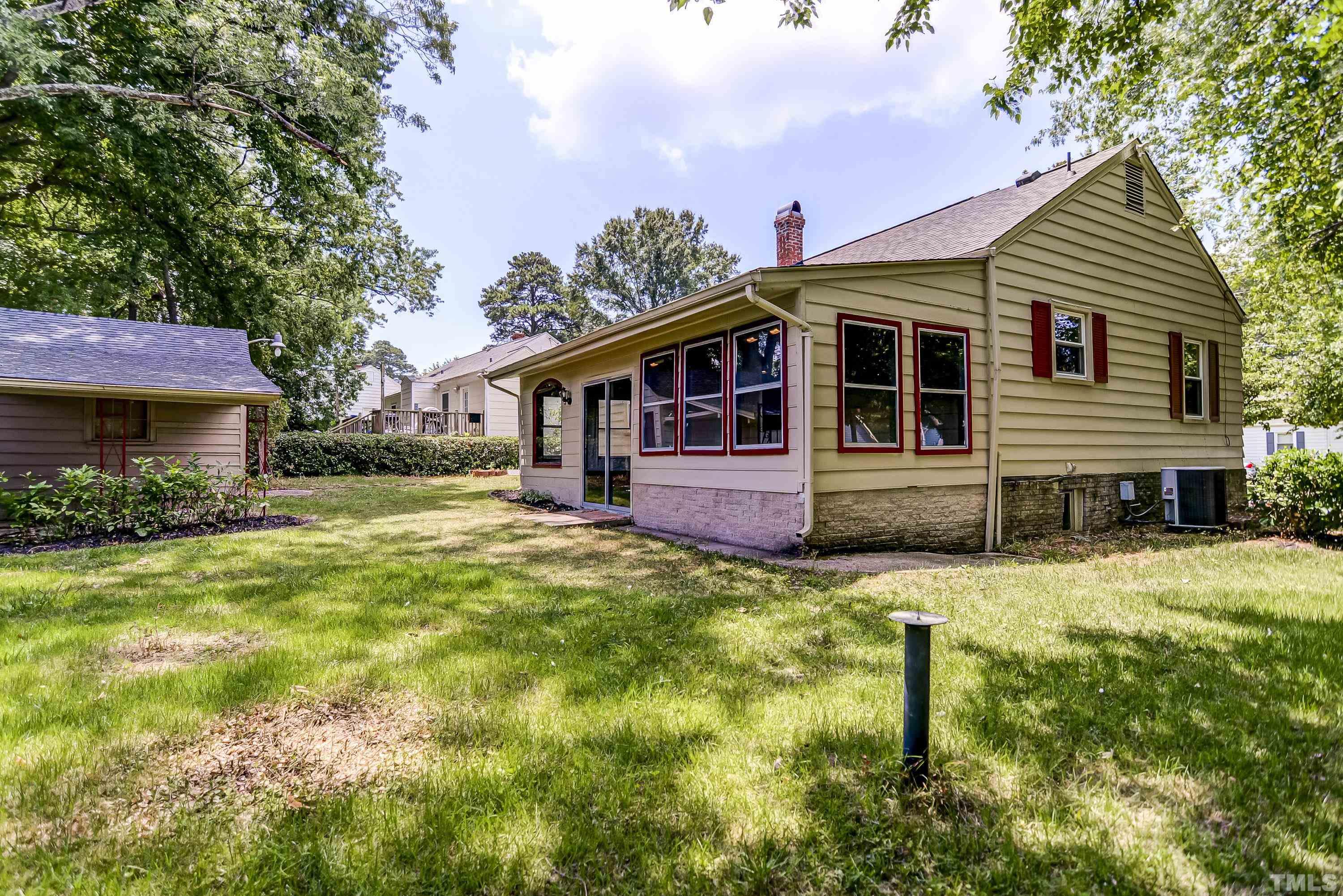 207 Myers Avenue Raleigh, NC 27604 - Photo 24 of 26 a front view of a house with a yard
