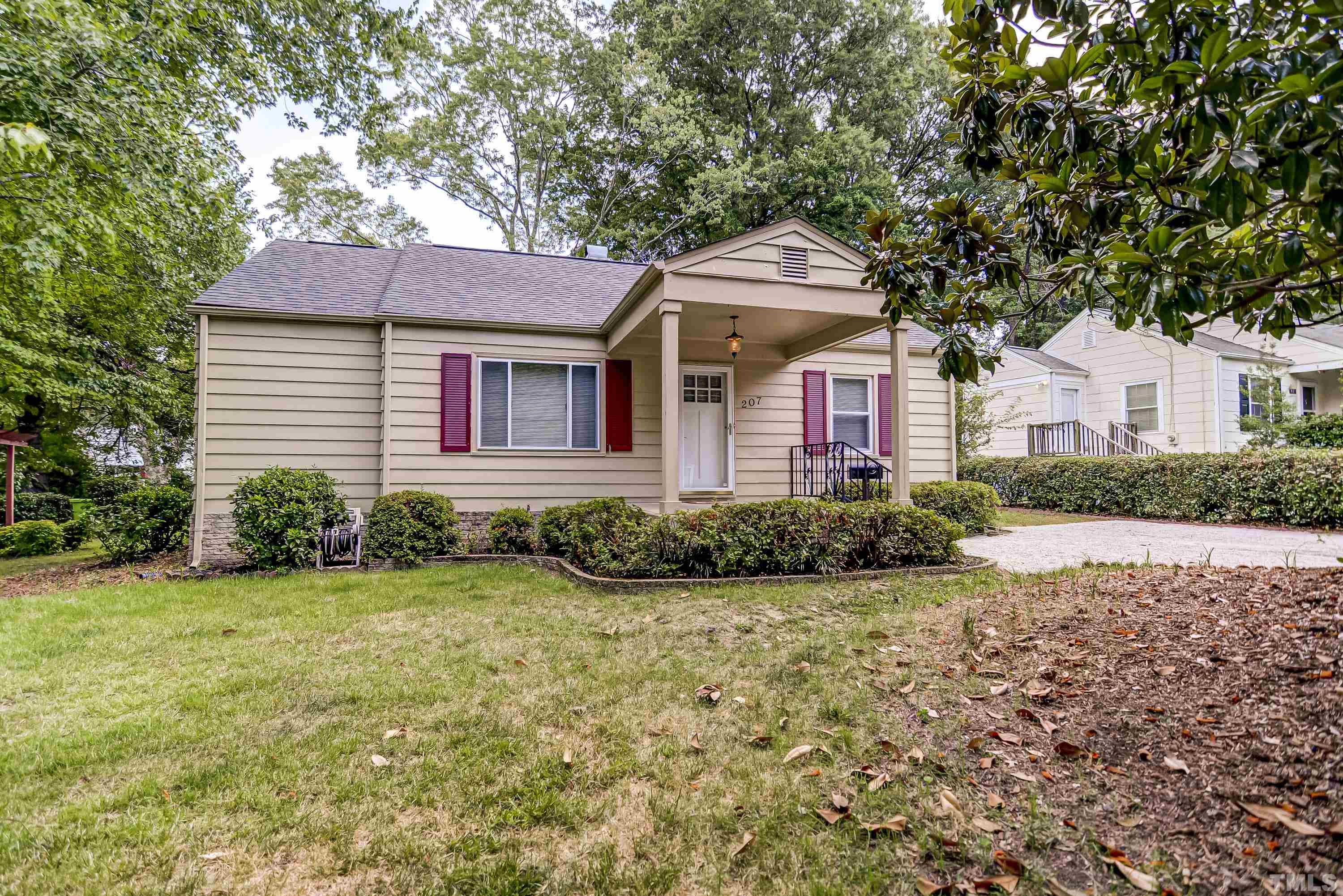 207 Myers Avenue Raleigh, NC 27604 - Photo 3 of 26 a front view of a house with garden
