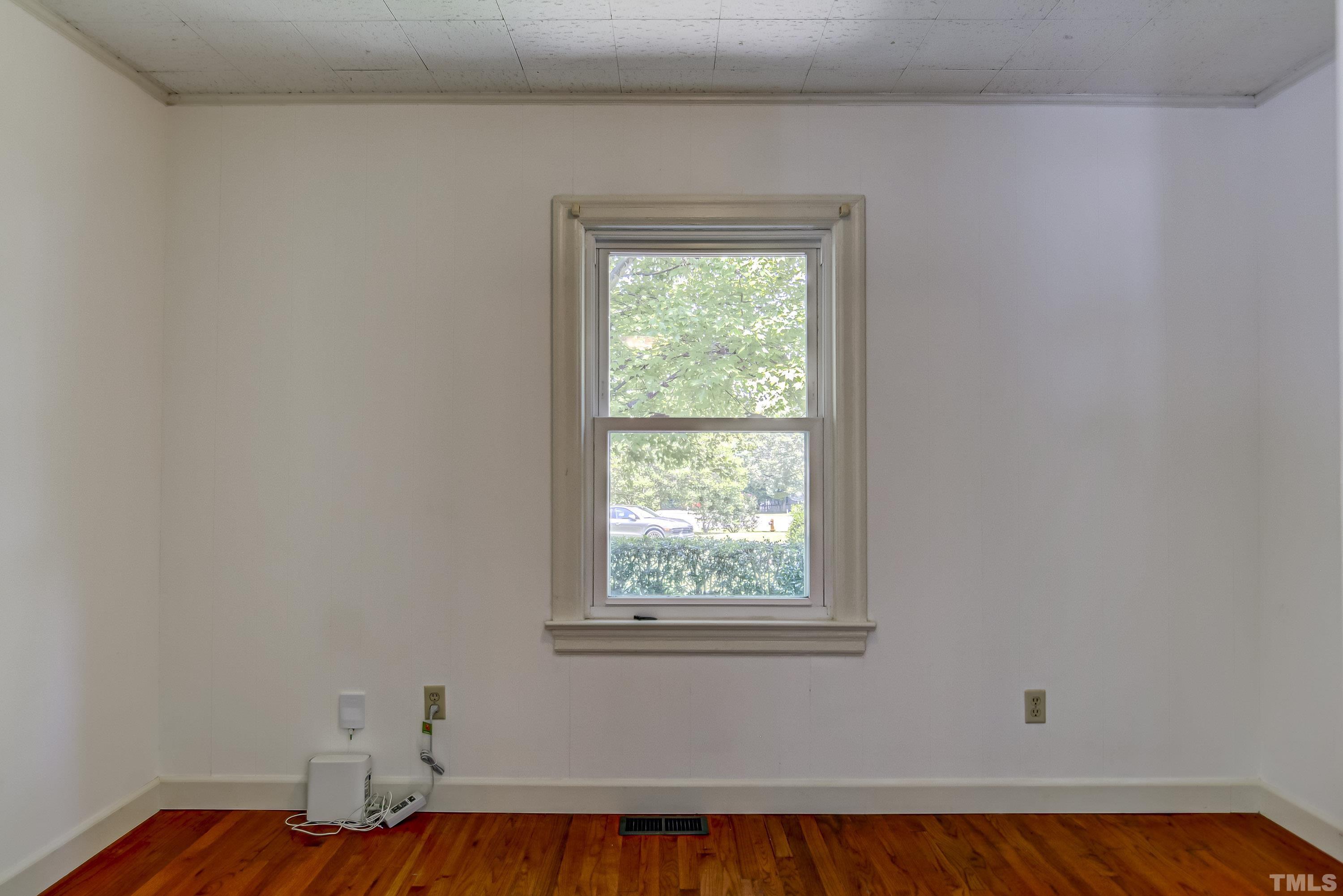 207 Myers Avenue Raleigh, NC 27604 - Photo 8 of 26 an empty room with a window