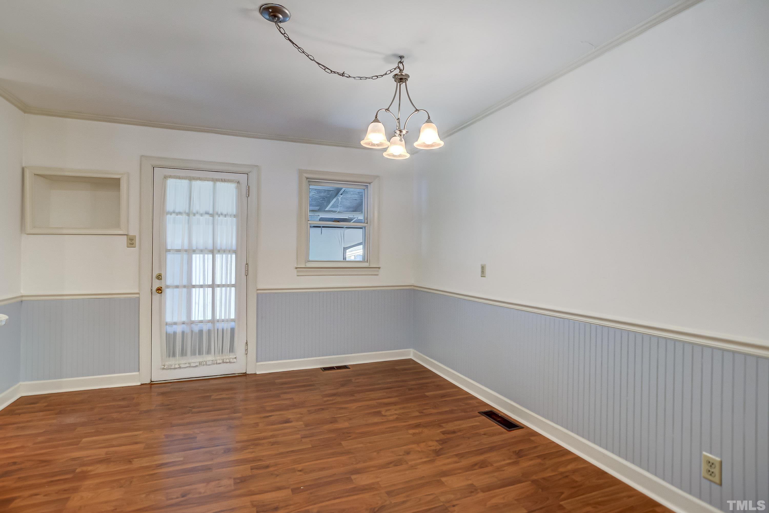 207 Myers Avenue Raleigh, NC 27604 - Photo 9 of 26 a view of empty room with wooden floor and fan