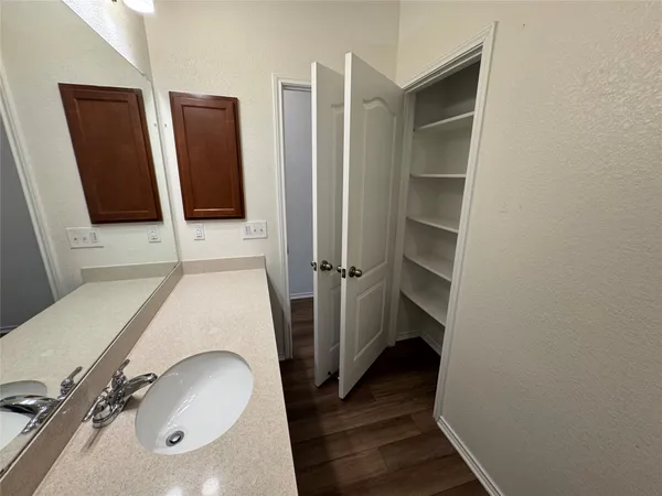 a view of a bathroom from the hallway