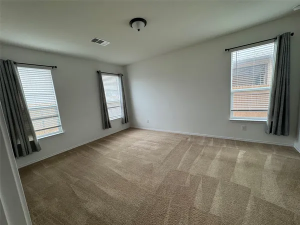 an empty room with wooden floor